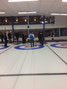 Mr John Morris providing instruction to members of the Strathcona Curling Team