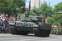 Capts Cam Meikle and Mike Timms waiving to the crowd from their Leopard 2A4 during the Calgary Stampede Parade.
