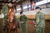 Capt Tardiff receives his spurs from outgoing Mounted Troop leader Capt Frizzell