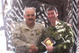 CECOMBAC’s CO, Col Cheg (left), presenting LdSH(RC) CO, LCol Peyton (right), with a gift during the smoker.