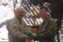 LdSH(RC) CO, LCol Peyton (right), presenting CECOMBAC’s CO, Col Cheg (left) with a rare Strathcona flag as a gift during the smoker.