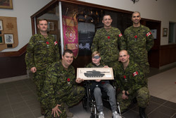 Honorary Trooper Ronan Smyth with Maj Anderson, MWO Stephen Churchill, Lt Mansour, MCpl Stephen Taborowski, and Cpl Richard Wagner