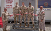 Members of the JTF-I and OSH SWA Command teams join Capt Deutschmann in opening the new Spiritual Centre at Camp Canada, AASAB 29 May 22.