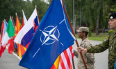 MCpl Cole “Fozzy Bear” Foster holds the NATO Flag while on parade during the Slovenian Minister of Defence visit.