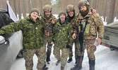 Sgt Suggitt and MCpl Buchanan posing with Italian Soldiers during Exercise STRIKE where they acted as Observers, Controllers, and Trainers to facilitate the exercise.