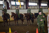Sgt Kruhlak stands in front of the riders prepared to put on a ride demonstration as the VIP guests arrive
